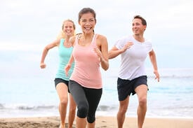 bigstock-Group-running-on-beach-jogging-66147076